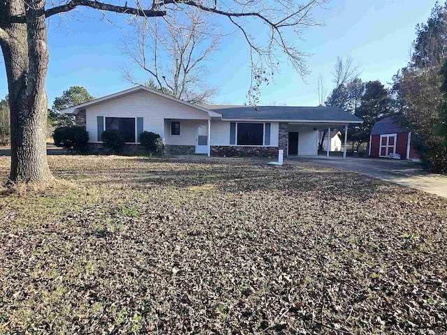 single story home with a shed and a carport