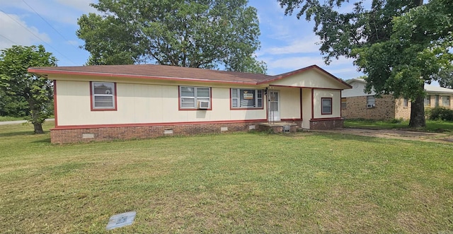 view of front facade with a front yard and cooling unit