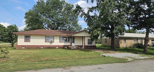 ranch-style home with a front lawn and cooling unit