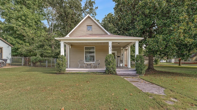 view of front facade with covered porch and a front yard