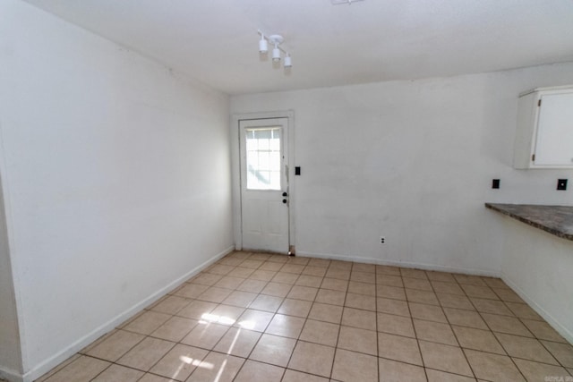 interior space featuring light tile patterned flooring