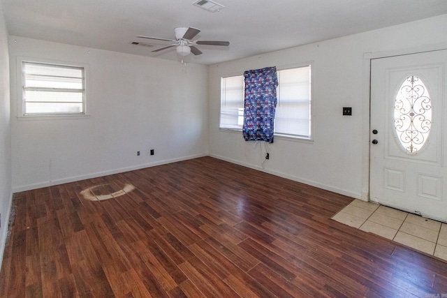 foyer featuring dark hardwood / wood-style floors, ceiling fan, and a healthy amount of sunlight