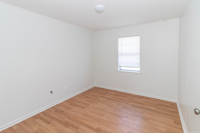 unfurnished room with light wood-type flooring