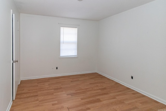 unfurnished room featuring light hardwood / wood-style floors