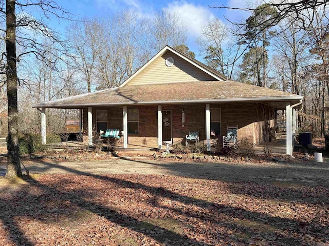 exterior space with a porch and central AC