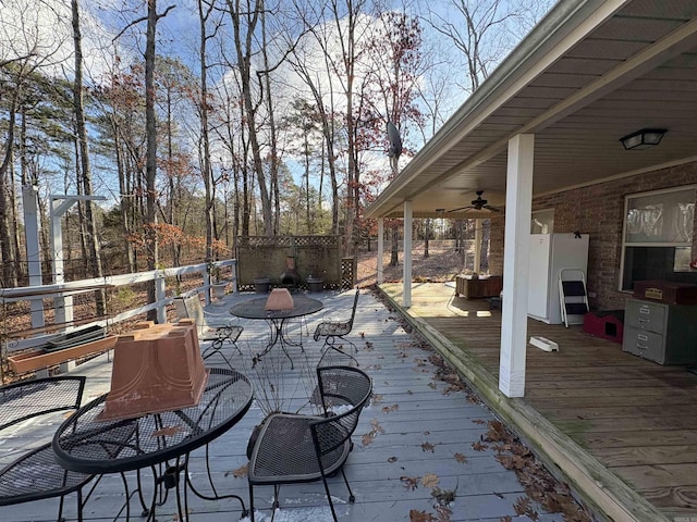 wooden terrace featuring ceiling fan