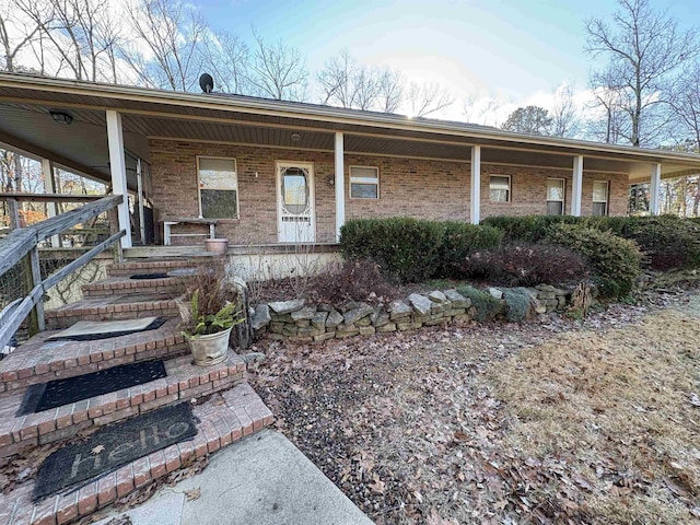 ranch-style home with covered porch