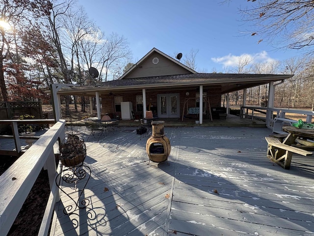 wooden deck featuring french doors