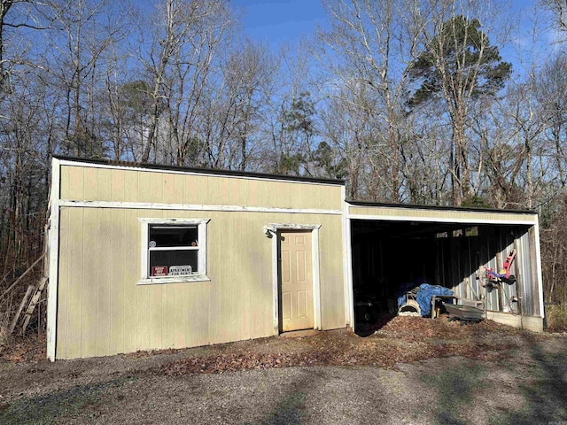 view of outbuilding featuring a carport