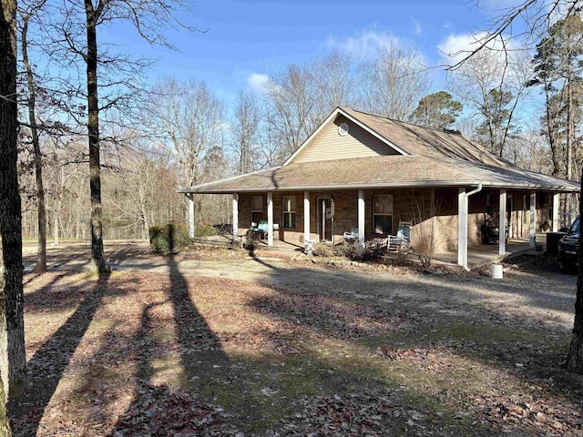 view of property exterior with covered porch