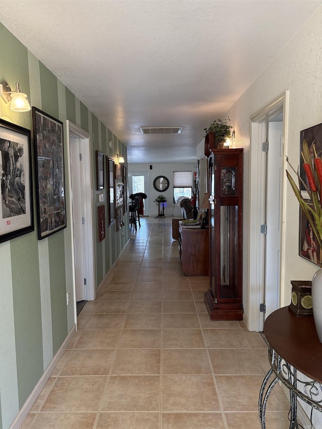 corridor featuring light tile patterned flooring