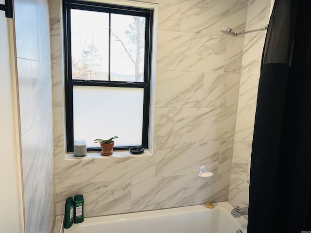 bathroom with shower / tub combo