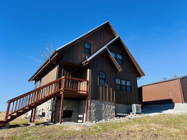 back of property with a wooden deck