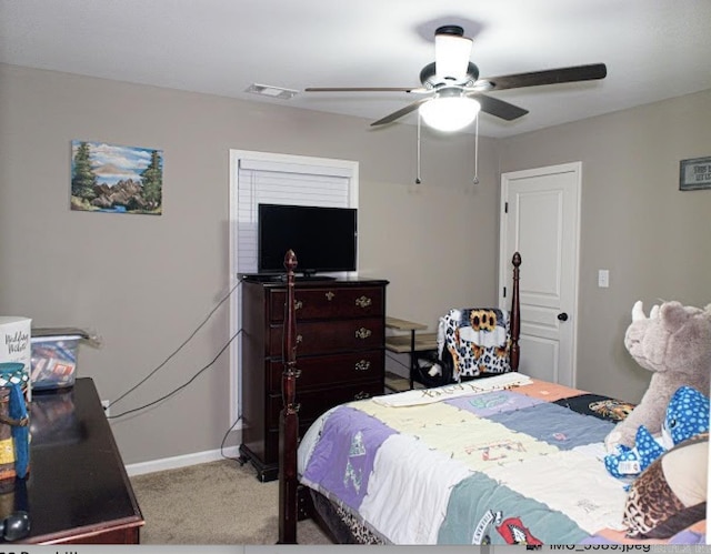 carpeted bedroom featuring ceiling fan