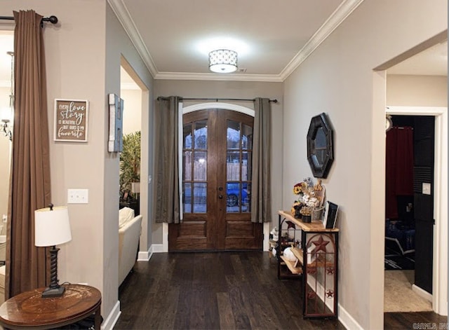 entrance foyer featuring dark hardwood / wood-style flooring, crown molding, and french doors