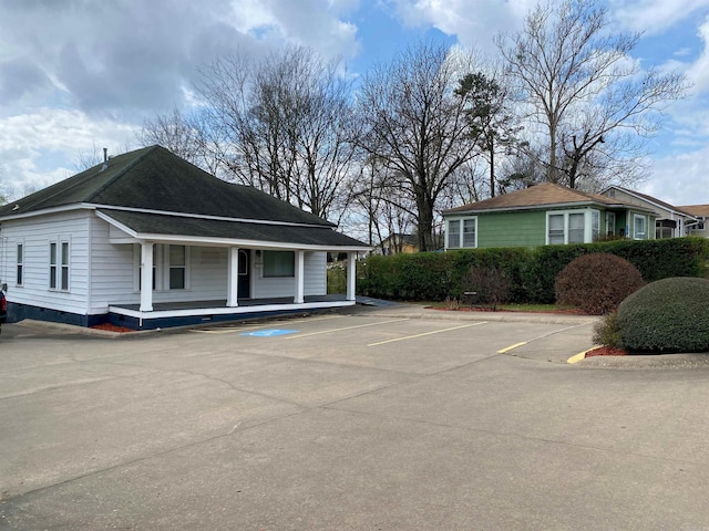 view of property exterior featuring a porch