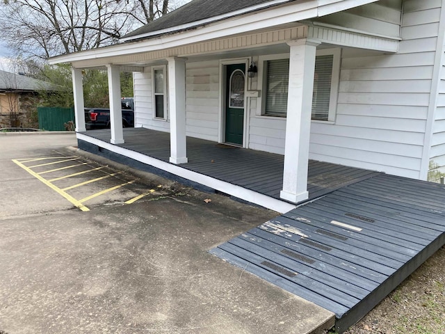 wooden deck featuring covered porch