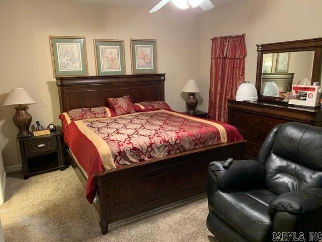 carpeted bedroom with ceiling fan