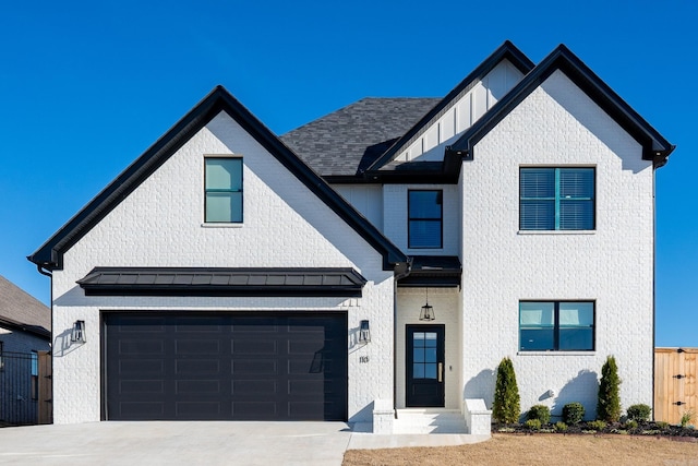 modern inspired farmhouse featuring a garage