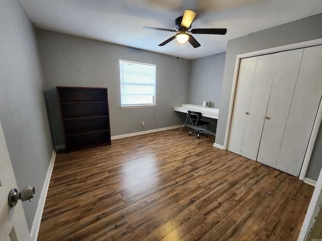 office space with ceiling fan and dark hardwood / wood-style floors