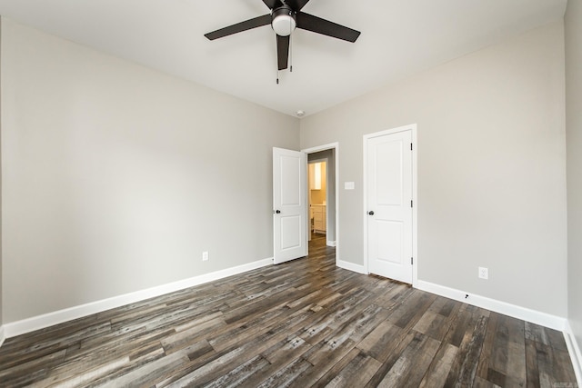 unfurnished room featuring ceiling fan and dark hardwood / wood-style flooring