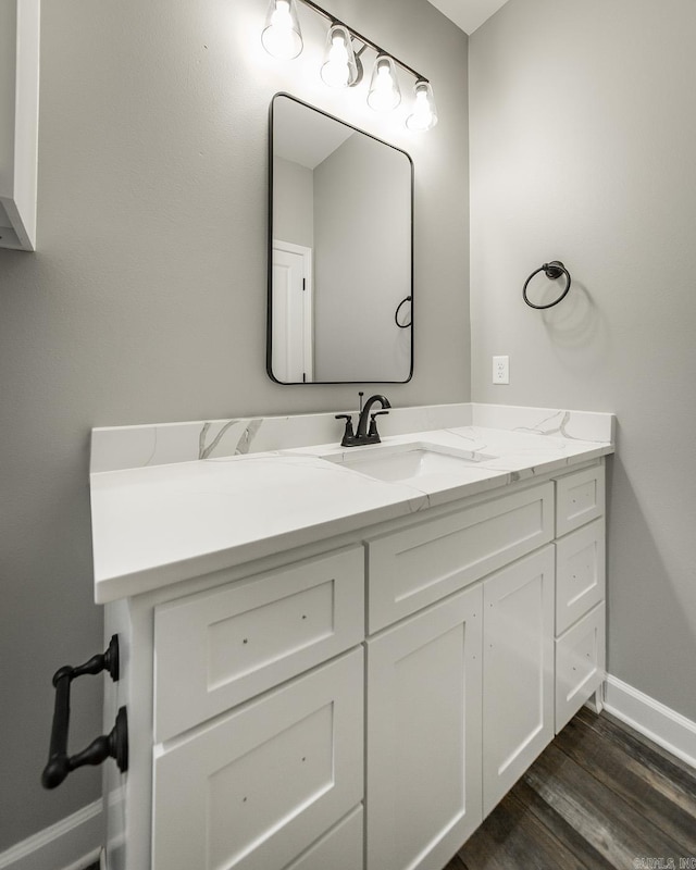 bathroom with vanity and hardwood / wood-style flooring