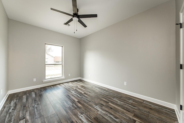 spare room featuring ceiling fan and dark hardwood / wood-style flooring