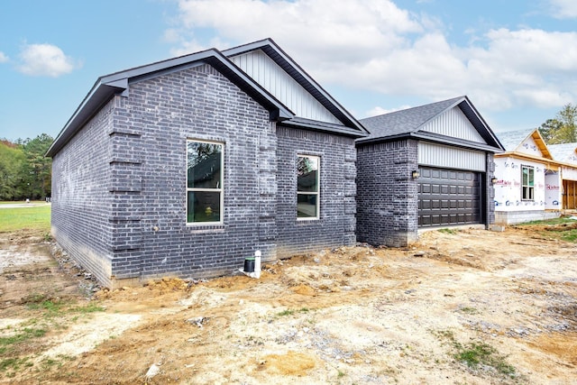 view of property exterior featuring a garage