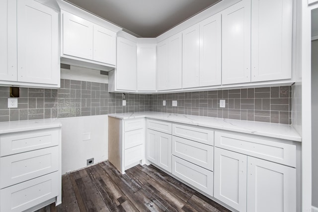 laundry room featuring dark wood-type flooring