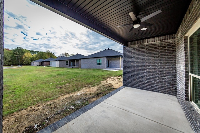 exterior space featuring ceiling fan