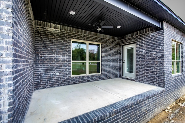 view of patio featuring ceiling fan