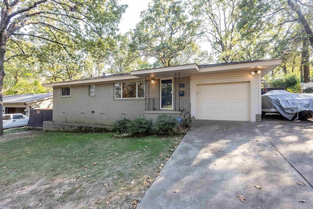 view of front facade with a front yard and a garage