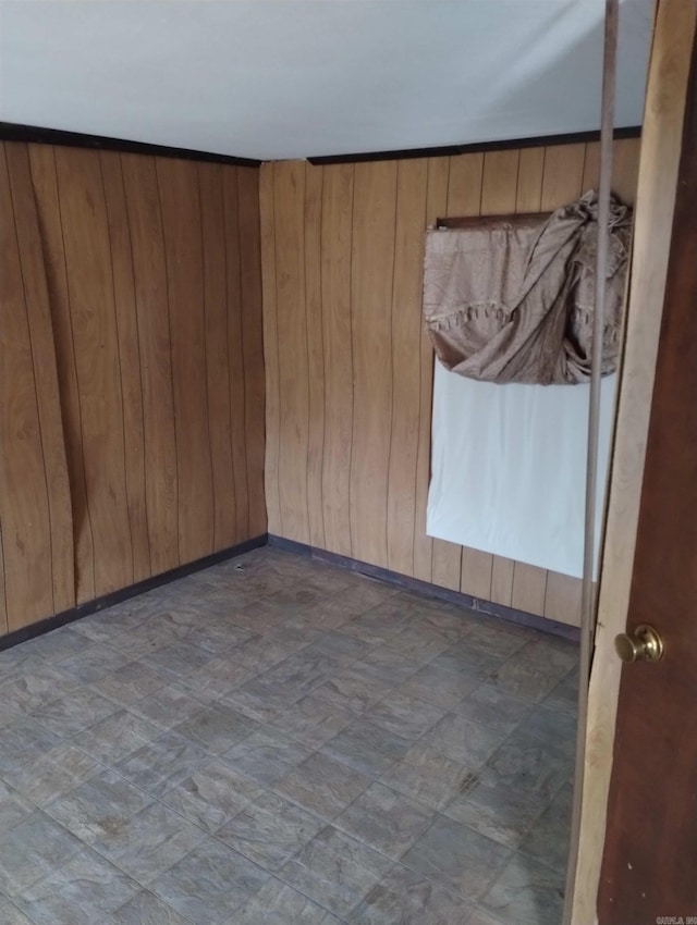 empty room with wooden walls