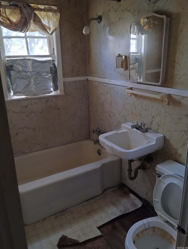 full bathroom featuring bathtub / shower combination, toilet, and sink