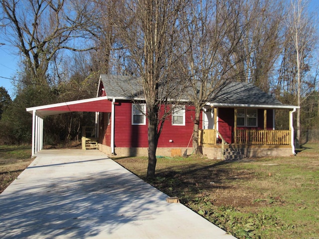 view of front of house featuring a porch and a carport