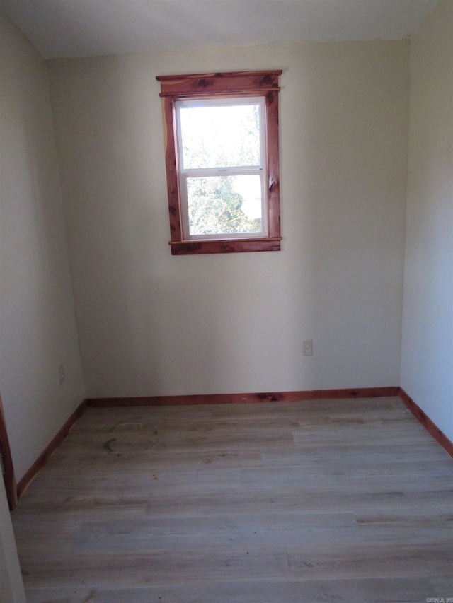 spare room featuring light wood-type flooring