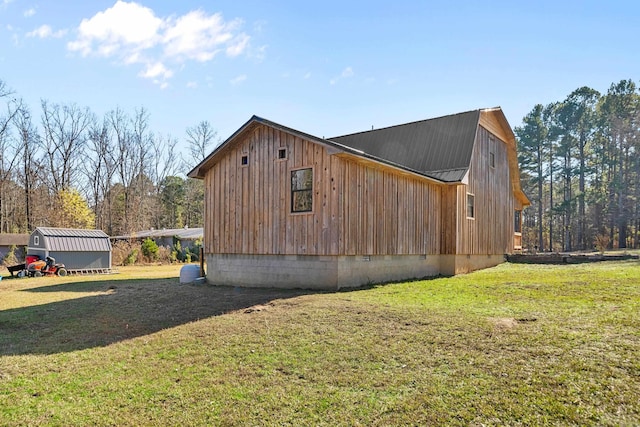 view of property exterior featuring a storage shed and a yard