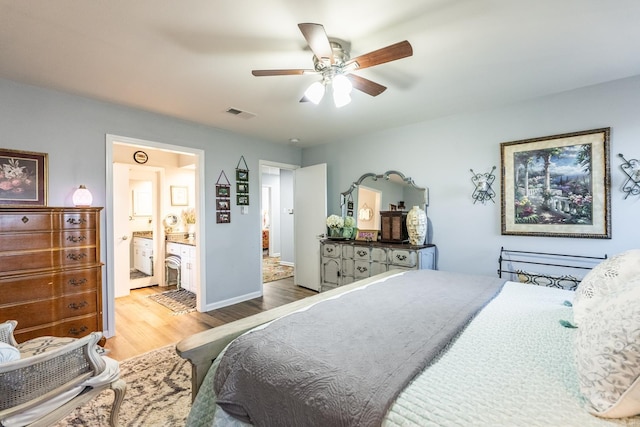 bedroom with hardwood / wood-style flooring, ceiling fan, and ensuite bathroom