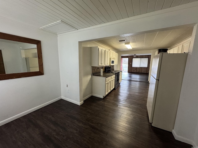 kitchen featuring white cabinets, dark hardwood / wood-style flooring, white appliances, and wood ceiling