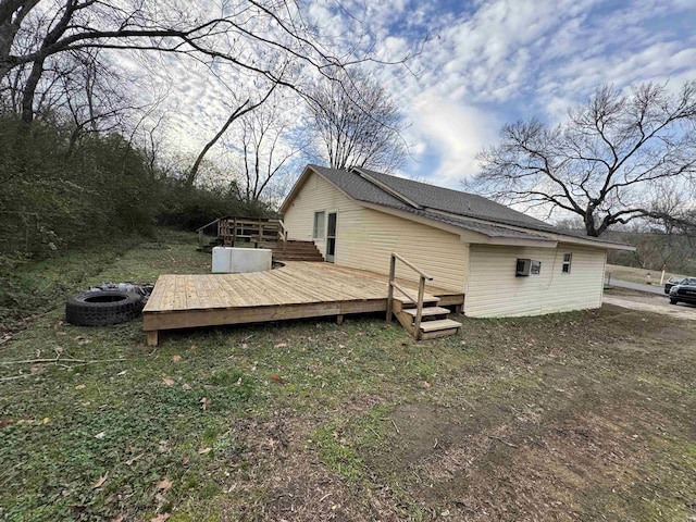 view of side of home with a wooden deck