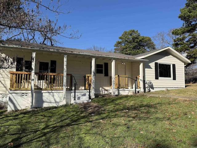 view of front of house with covered porch and a front yard