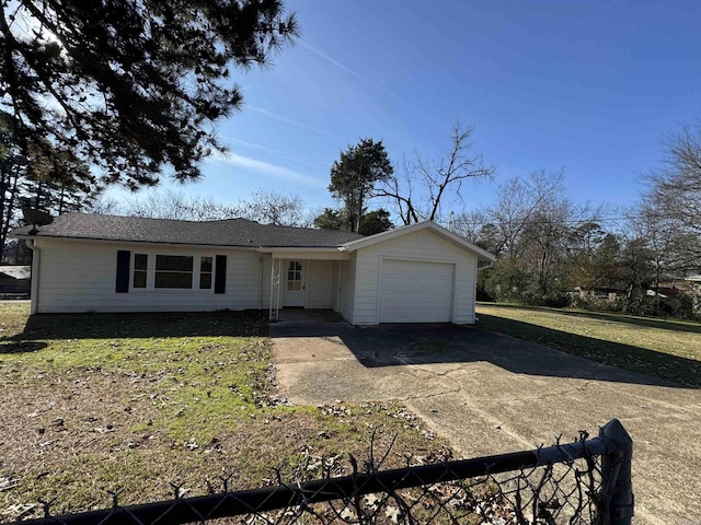 ranch-style house featuring a front lawn and a garage