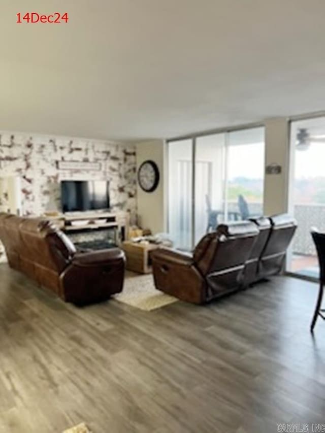 living room featuring hardwood / wood-style floors and floor to ceiling windows