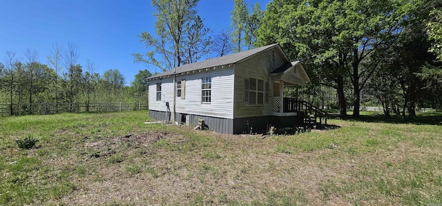 view of property exterior featuring a yard