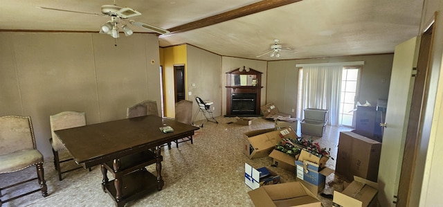 dining area with ceiling fan and lofted ceiling with beams