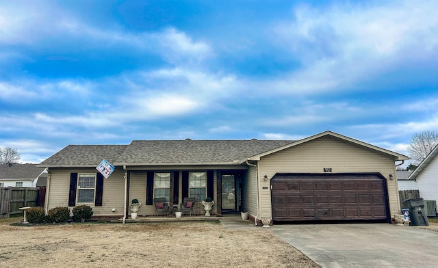 single story home with central AC unit, a porch, and a garage