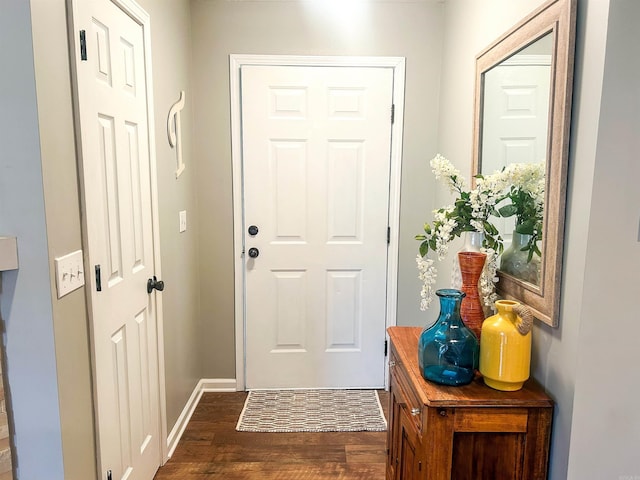 doorway to outside with dark wood-type flooring