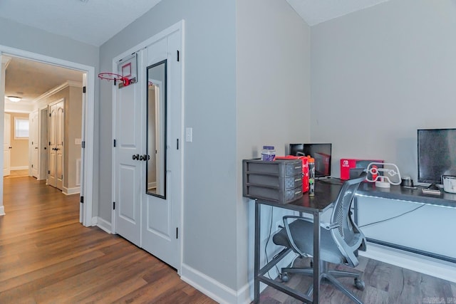 home office with dark hardwood / wood-style flooring