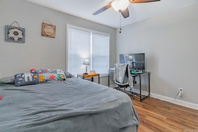 bedroom with hardwood / wood-style flooring and ceiling fan