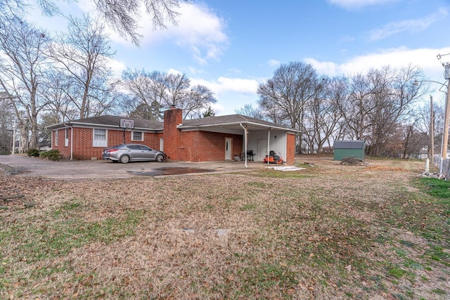 back of property featuring a carport